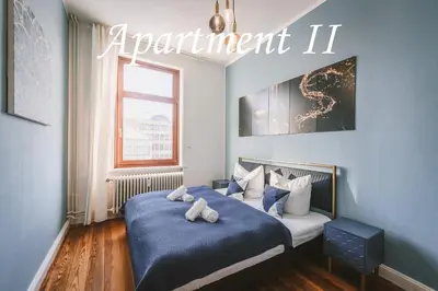 Ein Bett oder Betten in einem Zimmer der Unterkunft Sadebo Central Altbau Apartments Lübeck