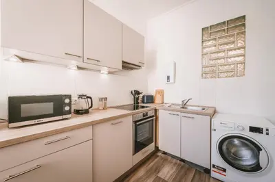 Küche/Küchenzeile in der Unterkunft Sadebo Central Altbau Apartments Lübeck