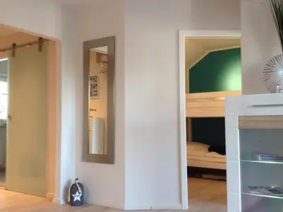Ein Bett oder Betten in einem Zimmer der Unterkunft StrandMÖWE Scharbeutz