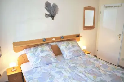 Ein Bett oder Betten in einem Zimmer der Unterkunft Am Rosenhain 12 Ferienwohnung Nr 03