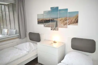 Ein Bett oder Betten in einem Zimmer der Unterkunft An der Seebrücke Ferienwohnung Nr 30