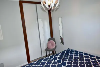 Ein Bett oder Betten in einem Zimmer der Unterkunft Lütt Hus an de See Ferienwohnung