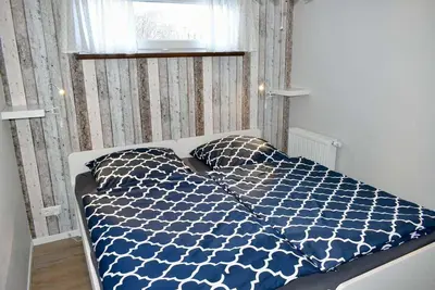 Ein Bett oder Betten in einem Zimmer der Unterkunft Lütt Hus an de See Ferienwohnung