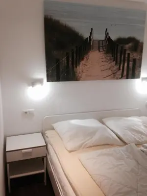 Ein Bett oder Betten in einem Zimmer der Unterkunft Apartmenthaus Seetempel