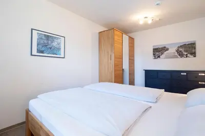 Ein Bett oder Betten in einem Zimmer der Unterkunft Mühlenteich App 14