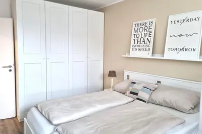 Ein Bett oder Betten in einem Zimmer der Unterkunft Bett u Butze Timmendorfer Strand Ferienwohnung