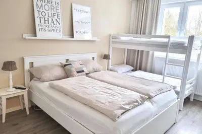 Ein Bett oder Betten in einem Zimmer der Unterkunft Bett u Butze Timmendorfer Strand Ferienwohnung
