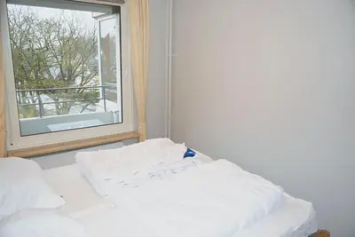 Ein Bett oder Betten in einem Zimmer der Unterkunft Carpe Diem Ferienwohnung Nr 143
