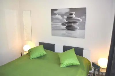 Ein Bett oder Betten in einem Zimmer der Unterkunft Domizil am Meer Nr 15 Ferienwohnung Meerblick
