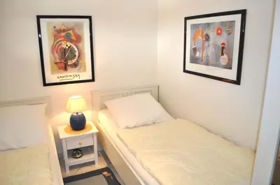 Ein Bett oder Betten in einem Zimmer der Unterkunft Domizil Royal Ferienwohnung Nr 22