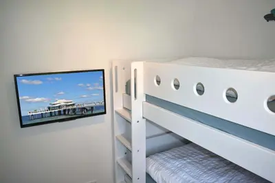 Ein Bett oder Betten in einem Zimmer der Unterkunft Fischerhus Ferienwohnung Deck 1