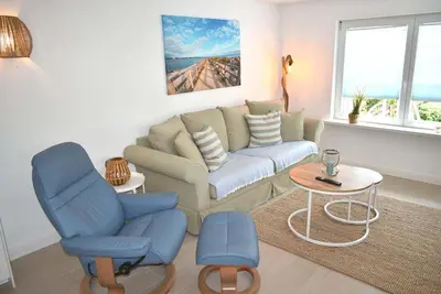 Ein Sitzbereich in der Unterkunft Fischerhus Ferienwohnung Deck 1