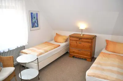Ein Bett oder Betten in einem Zimmer der Unterkunft Gästehaus Steinhardt Ferienwohnung Nr 03