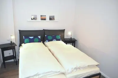 Ein Bett oder Betten in einem Zimmer der Unterkunft Hansehuus Ferienwohnung