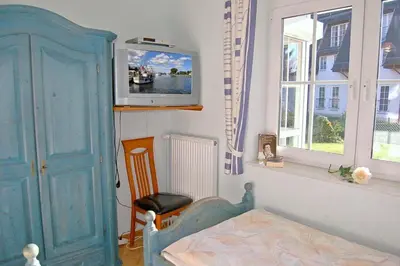 Ein Bett oder Betten in einem Zimmer der Unterkunft Haus am Kurpark Ferienwohnung Nr 03