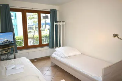 Ein Bett oder Betten in einem Zimmer der Unterkunft Haus am Strand Ferienwohnung Nr 05