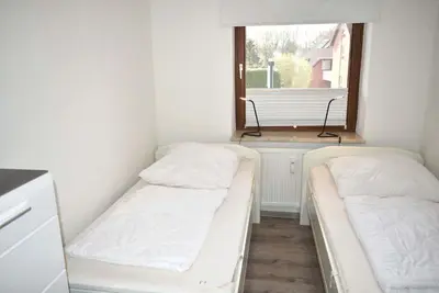 Ein Bett oder Betten in einem Zimmer der Unterkunft Haus Seeburg Ferienwohnung Nr 01