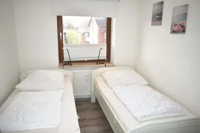 Ein Bett oder Betten in einem Zimmer der Unterkunft Haus Seeburg Ferienwohnung Nr 01