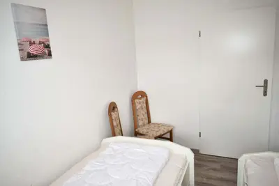 Ein Bett oder Betten in einem Zimmer der Unterkunft Haus Seeburg Ferienwohnung Nr 01