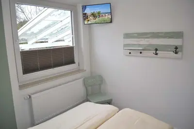 Ein Bett oder Betten in einem Zimmer der Unterkunft Haus Seehase Ferienwohnung Nr 01