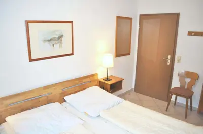 Ein Bett oder Betten in einem Zimmer der Unterkunft Haus Windrose Ferienwohnung Nr 01
