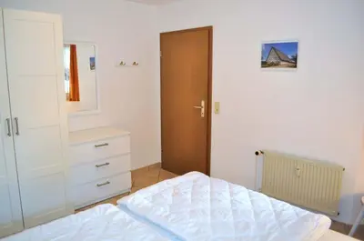 Ein Bett oder Betten in einem Zimmer der Unterkunft Haus Windrose Ferienwohnung Nr 08