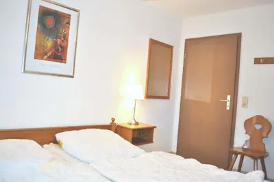 Ein Bett oder Betten in einem Zimmer der Unterkunft Haus Windrose Ferienwohnung Nr 09