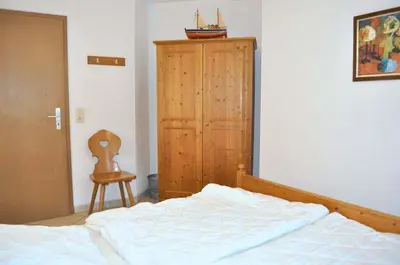 Ein Bett oder Betten in einem Zimmer der Unterkunft Haus Windrose Ferienwohnung Nr 09