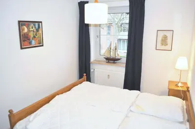 Ein Bett oder Betten in einem Zimmer der Unterkunft Haus Windrose Ferienwohnung Nr 09