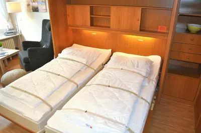 Ein Bett oder Betten in einem Zimmer der Unterkunft Muschel Appartement