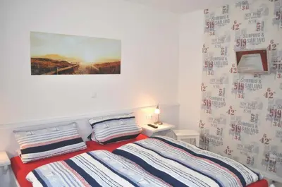 Ein Bett oder Betten in einem Zimmer der Unterkunft Ostseeallee 11 Ferienwohnung Rauschen