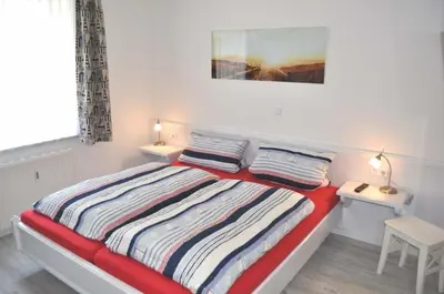 Ein Bett oder Betten in einem Zimmer der Unterkunft Ostseeallee 11 Ferienwohnung Rauschen