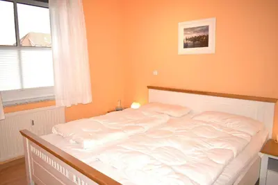 Ein Bett oder Betten in einem Zimmer der Unterkunft Ostseeallee 2 Ferienwohnung Nr 05