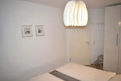 Ein Bett oder Betten in einem Zimmer der Unterkunft Ostseeallee 33 Ferienwohnung Ostseeliebe
