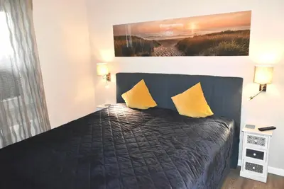 Ein Bett oder Betten in einem Zimmer der Unterkunft Ostseeallee 4 Ferienwohnung Nr 01