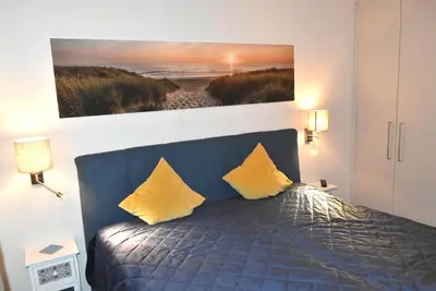 Ein Bett oder Betten in einem Zimmer der Unterkunft Ostseeallee 4 Ferienwohnung Nr 01