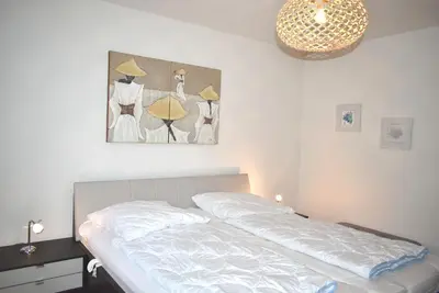 Ein Bett oder Betten in einem Zimmer der Unterkunft Residenz Johannsens Ferienwohnung Nr 04