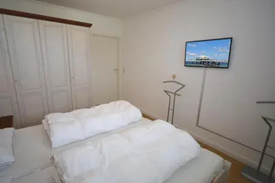 Ein Bett oder Betten in einem Zimmer der Unterkunft Residenz Niendorf Ferienwohnung Nr 32
