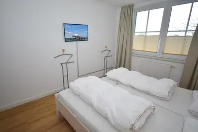 Ein Bett oder Betten in einem Zimmer der Unterkunft Residenz Niendorf Ferienwohnung Nr 32