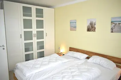 Ein Bett oder Betten in einem Zimmer der Unterkunft Residenz Niendorf Ferienwohnung Nr 33