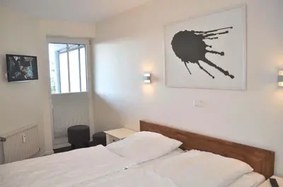 Ein Bett oder Betten in einem Zimmer der Unterkunft Residenz Ostseestrand Ferienwohnung Nr 15 Meerblick