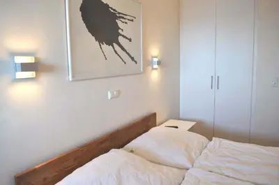 Ein Bett oder Betten in einem Zimmer der Unterkunft Residenz Ostseestrand Ferienwohnung Nr 15 Meerblick
