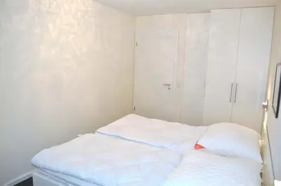 Ein Bett oder Betten in einem Zimmer der Unterkunft Residenz Ostseestrand Ferienwohnung Nr 21 Meerblick