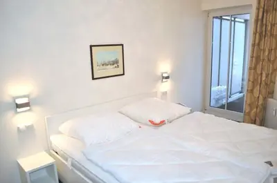 Ein Bett oder Betten in einem Zimmer der Unterkunft Residenz Ostseestrand Ferienwohnung Nr 21 Meerblick