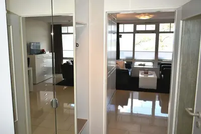 Ein Sitzbereich in der Unterkunft Strandhotel Appartement Nr 14 Meerblick