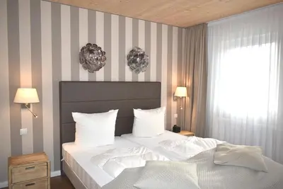 Ein Bett oder Betten in einem Zimmer der Unterkunft Villa Somersby Ferienwohnung Nr 03