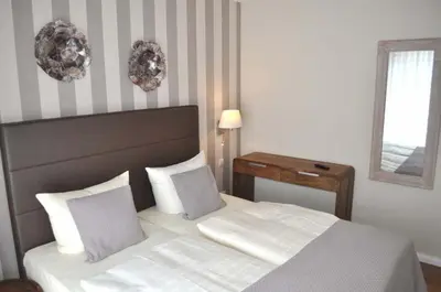 Ein Bett oder Betten in einem Zimmer der Unterkunft Villa Somersby Ferienwohnung Nr 05