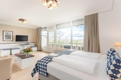 Ein Bett oder Betten in einem Zimmer der Unterkunft Ferienwohnungen Strandgrün