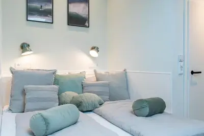 Ein Bett oder Betten in einem Zimmer der Unterkunft Ferienhaus SURF COAST - Haffkrug