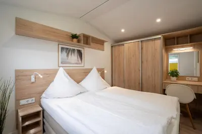 Ein Bett oder Betten in einem Zimmer der Unterkunft Ostseecamp Ferienhaus 
